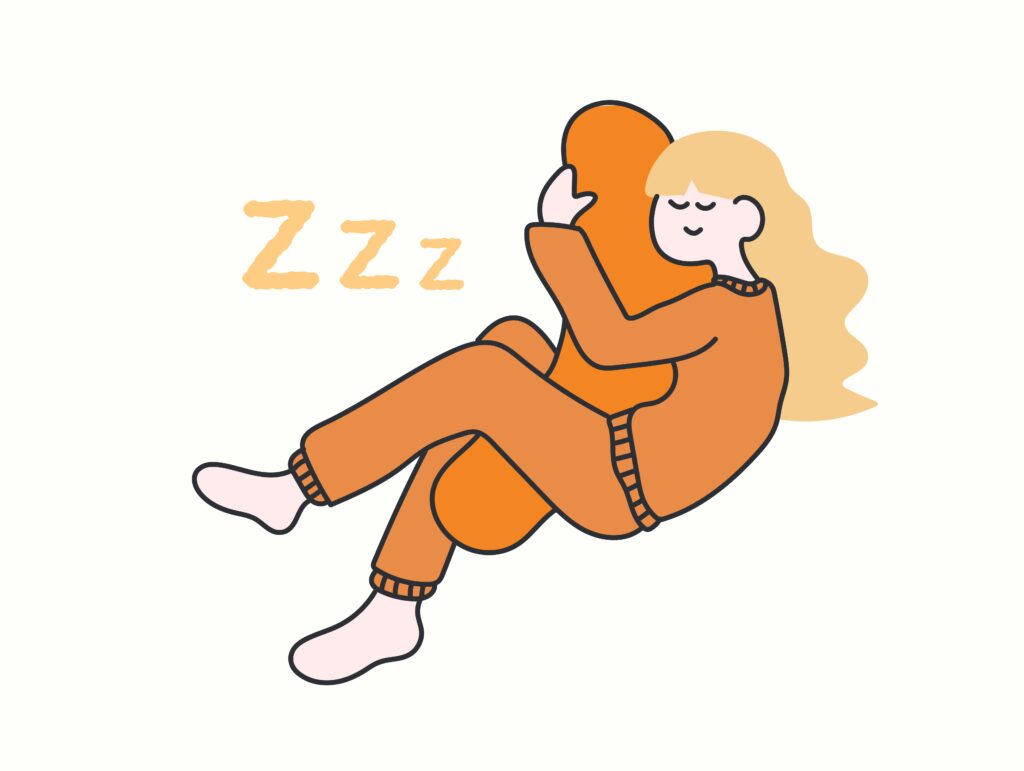 抱き枕で眠る女性