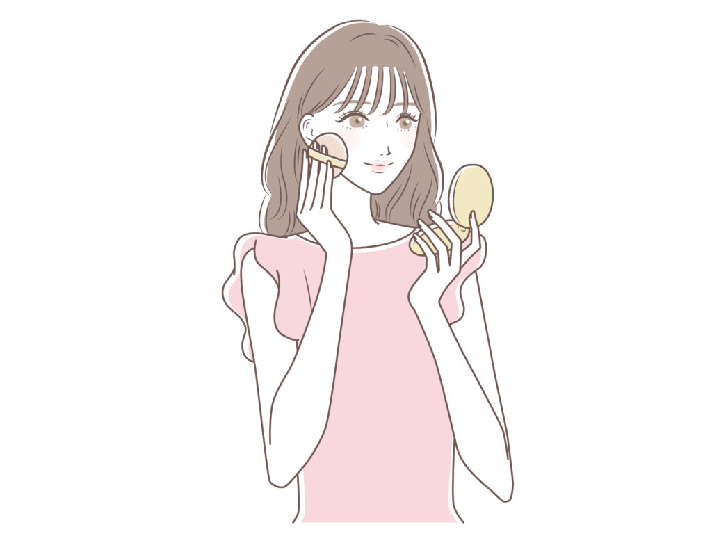 ファンデーションを塗っている女性