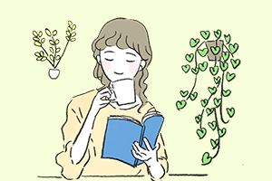 お茶と読書でくつろぐ女性