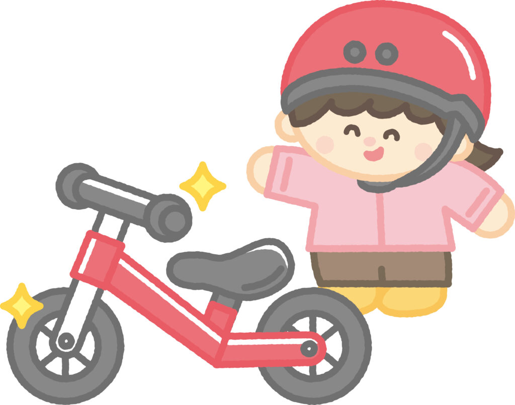 キックバイクと喜ぶ女の子