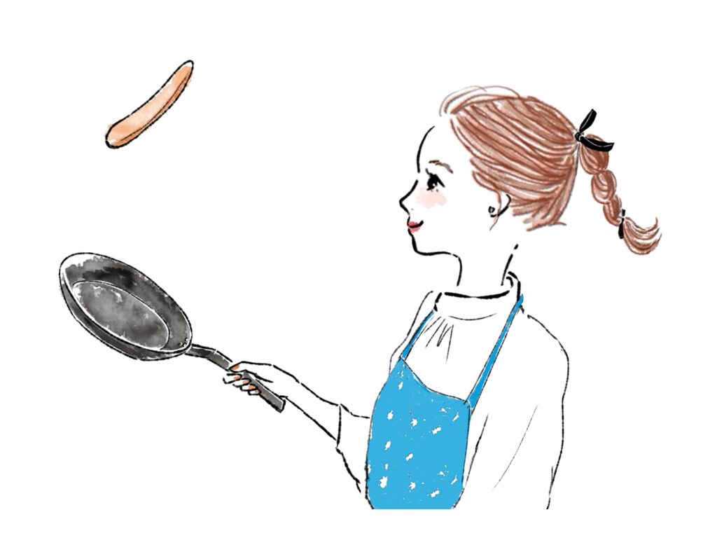 ウインナーを焼く女性