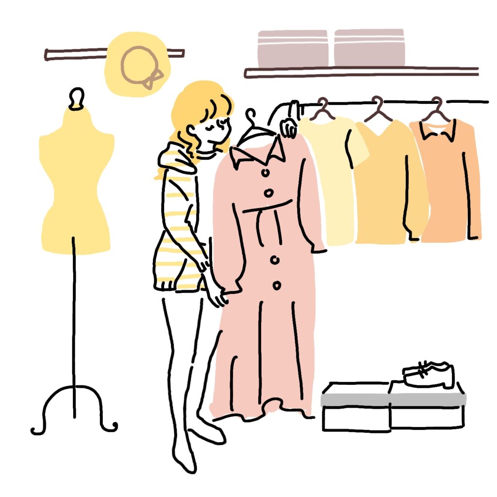 服を選ぶ女性