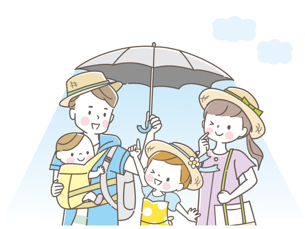 日傘をさしてお出かけする家族