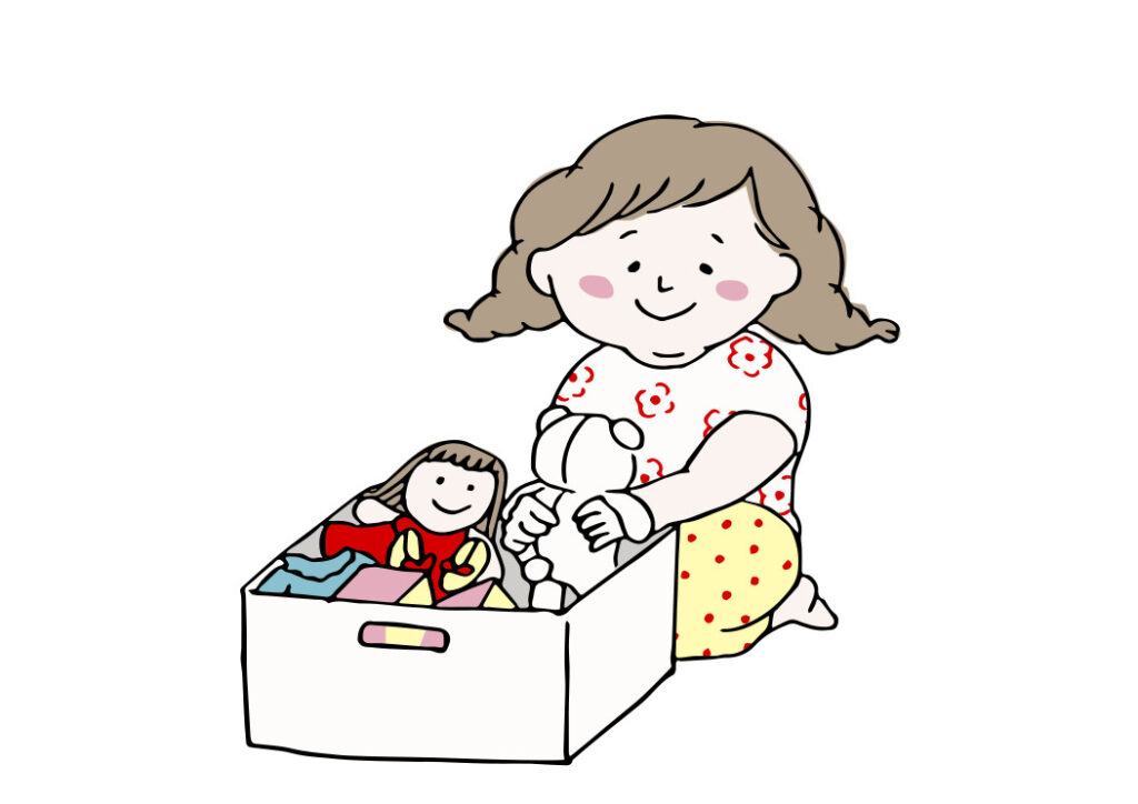 人形を片付ける女の子