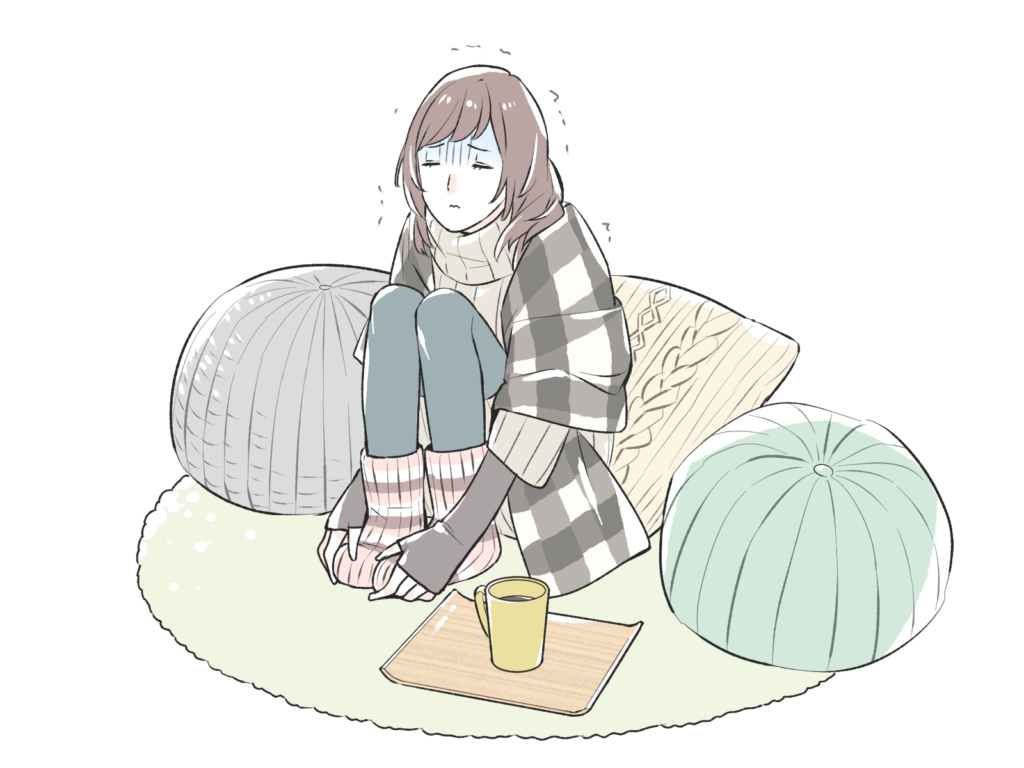 冷え性で寒さに震える女性