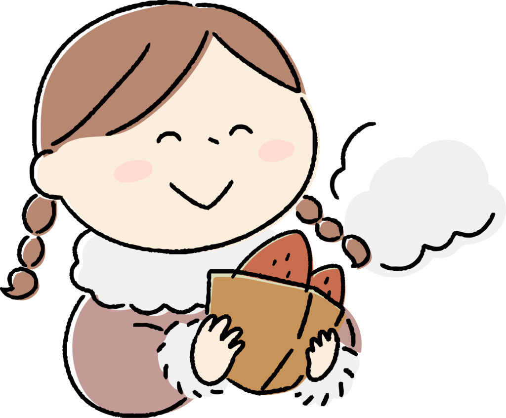 美味しい焼き芋を持つ女性