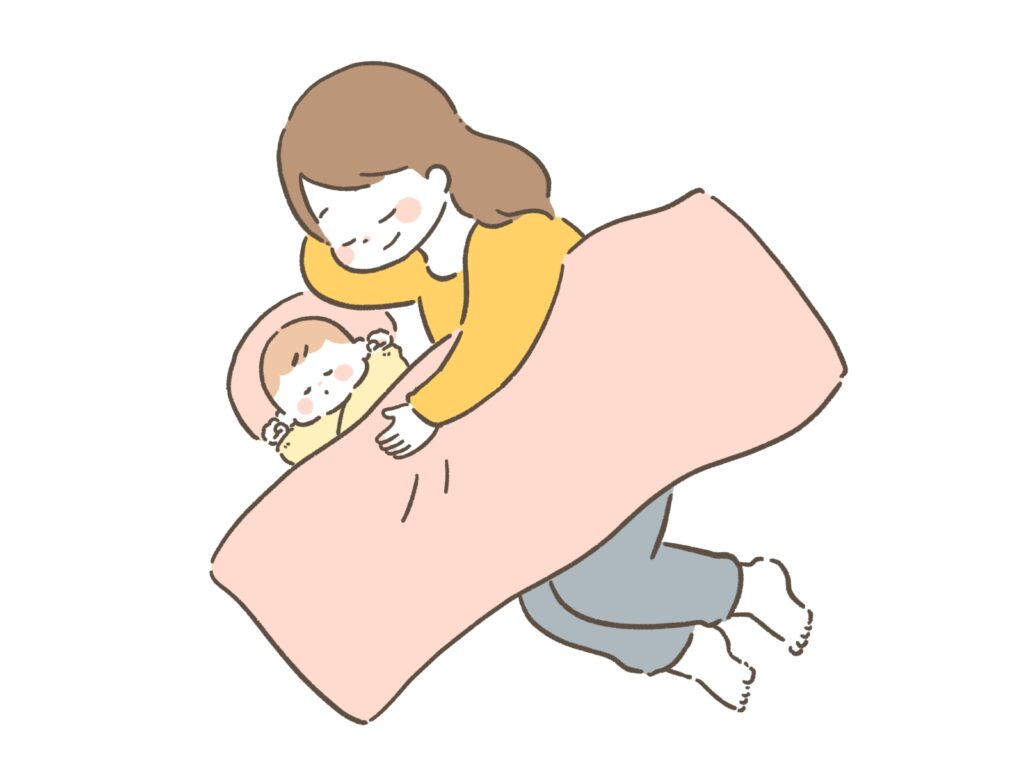 赤ちゃんと寝かしつけるママ