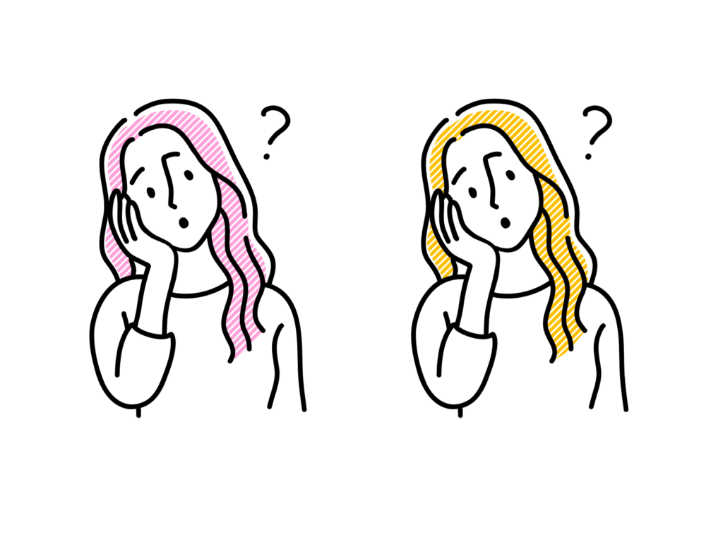 首を傾げる女性