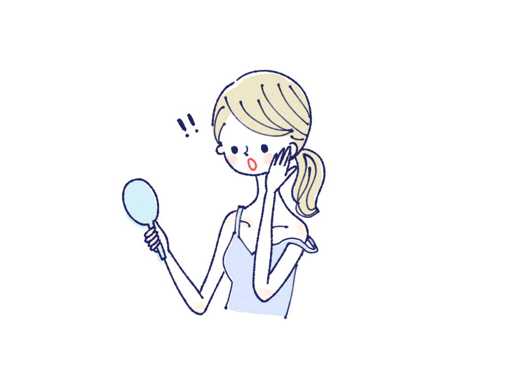 鏡を見て驚く女性