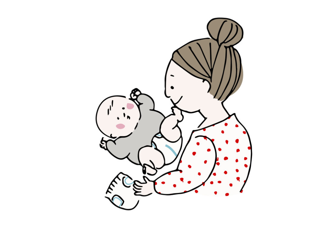 赤ちゃんのオムツを替える女性