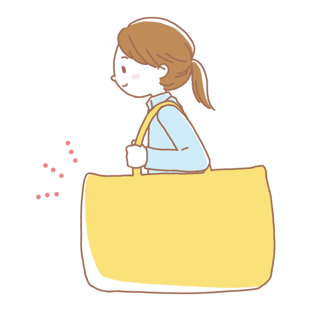 お昼寝布団バッグを持つ女性