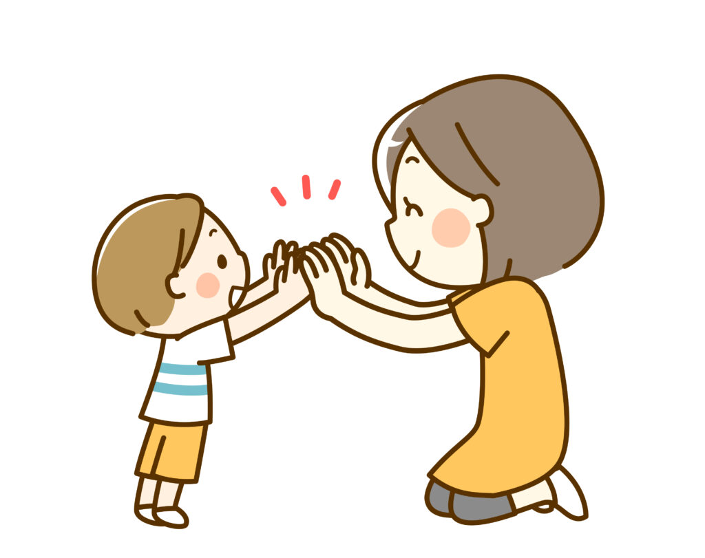 ハイタッチする親子