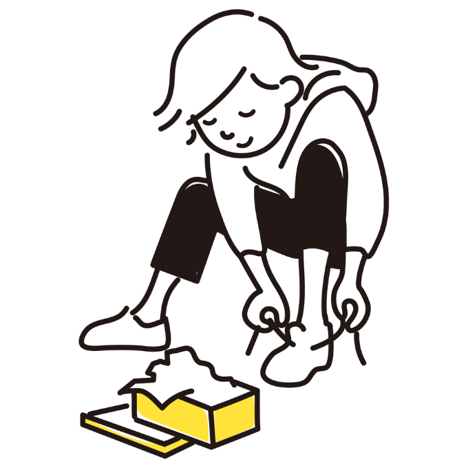 スニーカーを試着する人