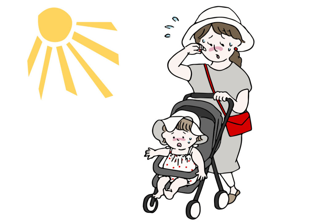 暑い日におでかけする親子