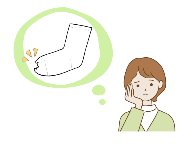 靴下の穴に悩む女性